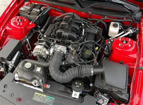 It sounds like it is coming from the area of the valve cover or intake plenum on. . 2005 mustang engine